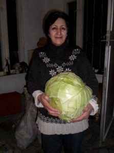 Armenian woman shows off her amazing cabbage bounty using the Mittleider Gardening method. Now THAT'S Blue Ribbon worthy! (photo courtesy of Food For Everyone.org)